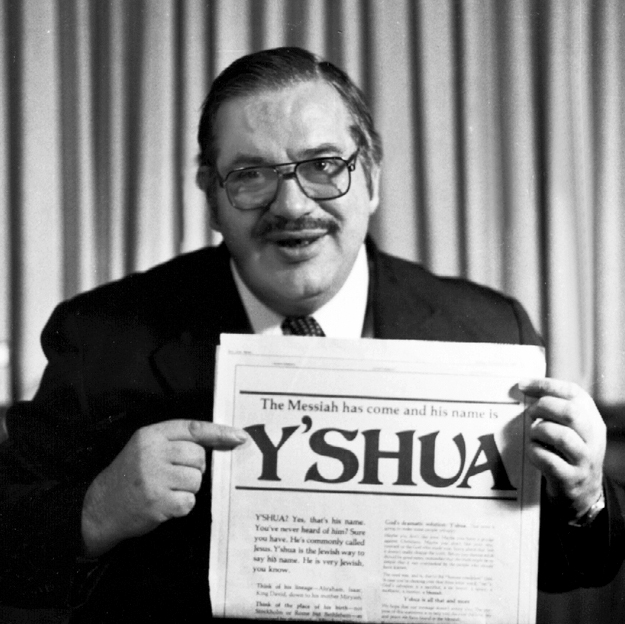 Moish Rosen holding newspaper with Y'shua headline